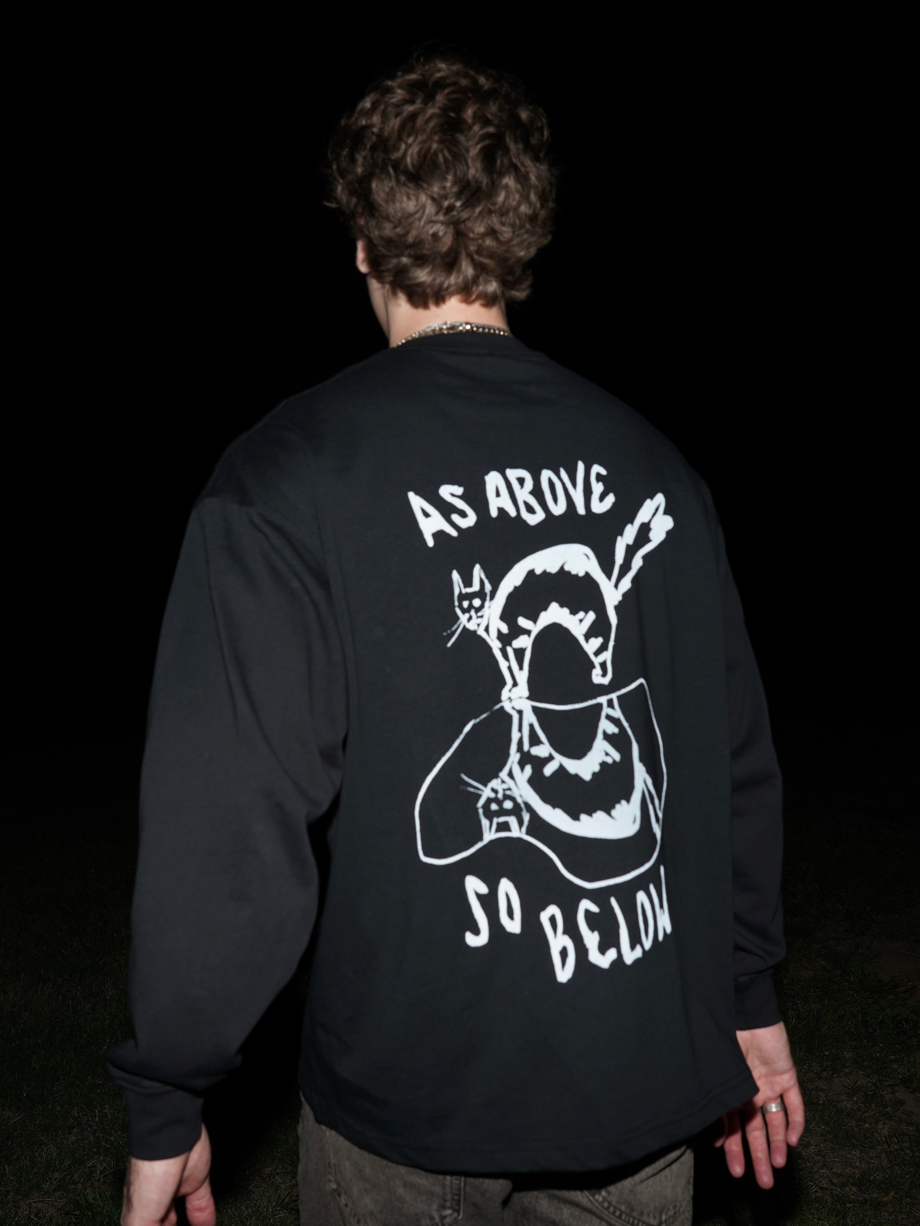 Model wearing black streetwear long sleeve back side KILOS clothing 
