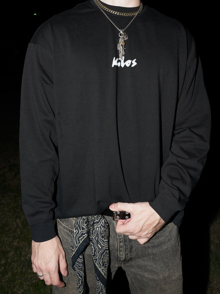 Model wearing black streetwear long sleeve front side KILOS clothing 