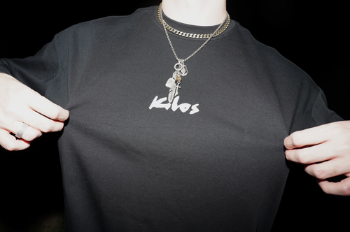 KILOS Streetwear long sleeve with logo held up